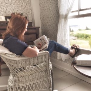 Here I am captured writing in my journal while overlooking the Atlantic Ocean in Maine.